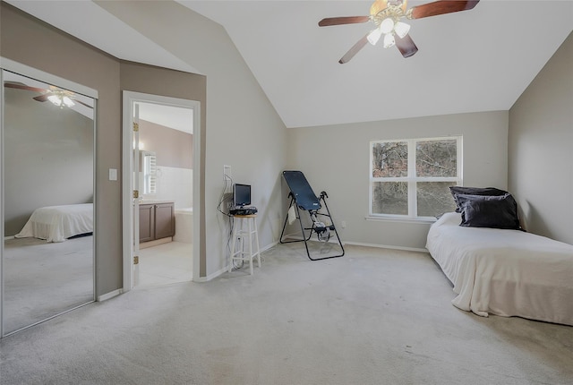 bedroom with ceiling fan, light colored carpet, and lofted ceiling