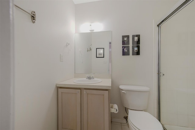 bathroom with vanity, an enclosed shower, and toilet