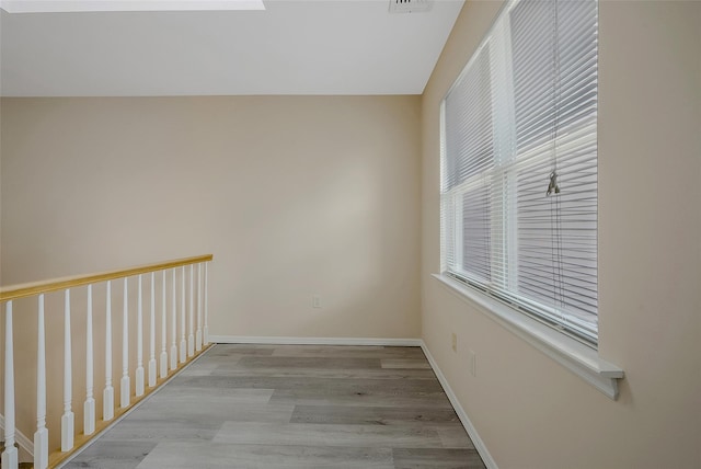 spare room with light wood-type flooring