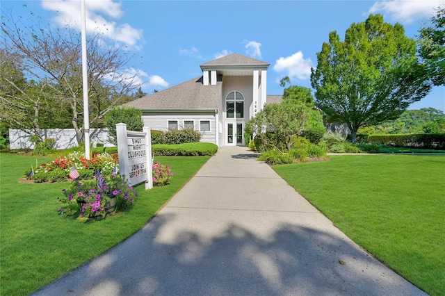 view of front of property with a front lawn