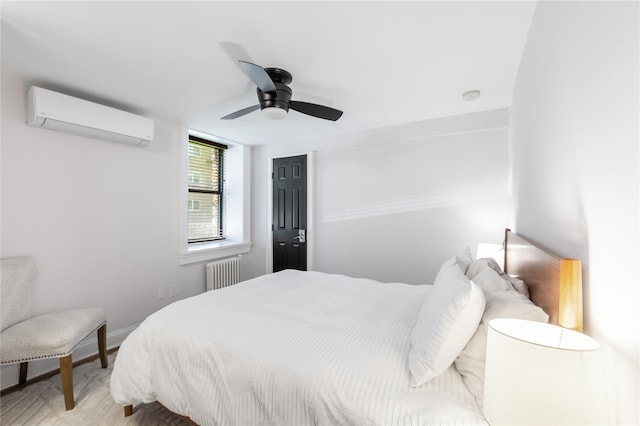 bedroom featuring radiator, a wall mounted air conditioner, and ceiling fan