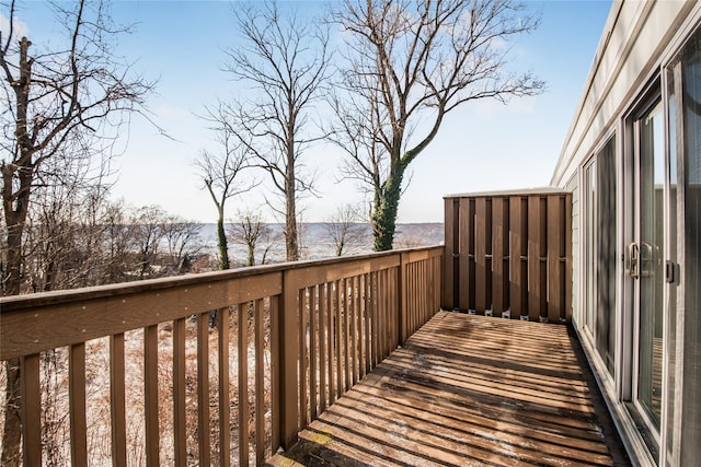 wooden deck featuring a water view