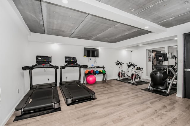 exercise room featuring light hardwood / wood-style flooring