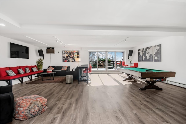 game room with hardwood / wood-style flooring, rail lighting, and pool table