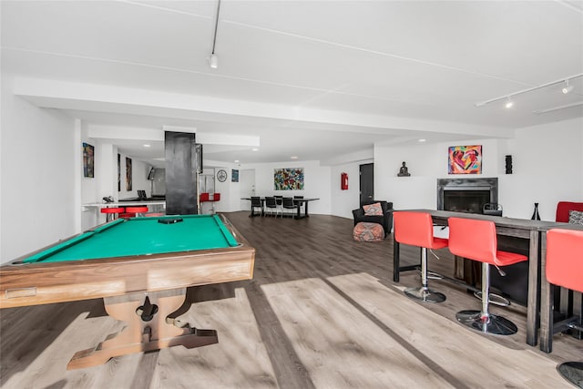 playroom featuring hardwood / wood-style floors, billiards, and a fireplace