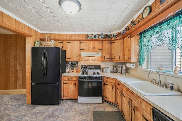 kitchen with dishwasher, sink, ornamental molding, black fridge, and gas range oven