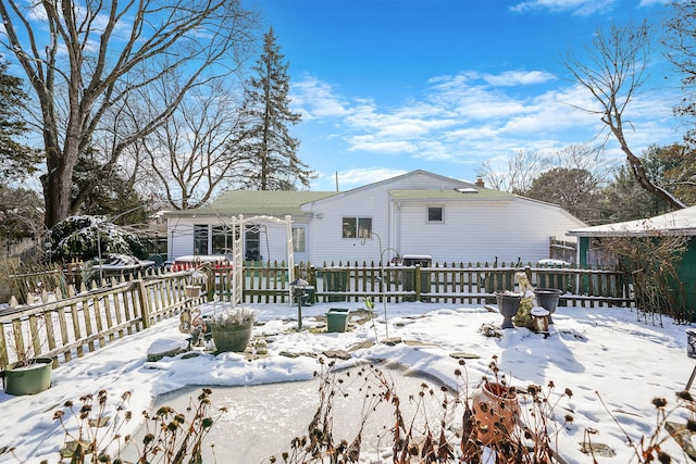 view of snow covered house