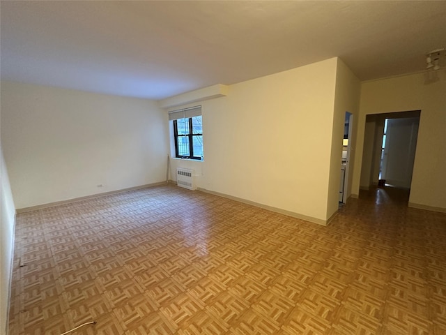 spare room with light parquet floors