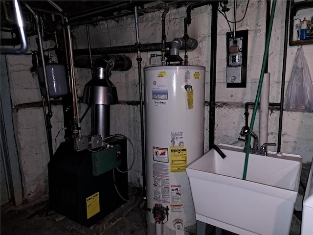 utilities featuring sink and water heater