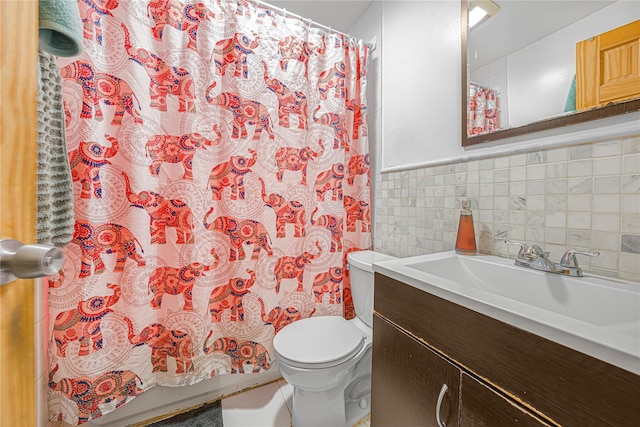 bathroom featuring tile walls, toilet, and vanity