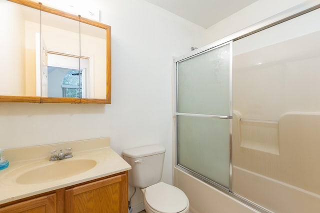 full bathroom with toilet, shower / bath combination with glass door, and vanity