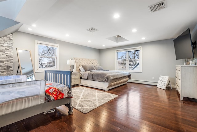 bedroom featuring a baseboard radiator, vaulted ceiling, and dark hardwood / wood-style flooring