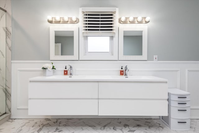 bathroom with a shower with door and vanity