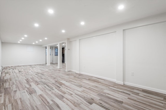 basement featuring light wood-type flooring