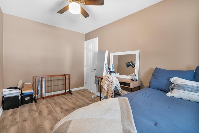 bedroom with ceiling fan and light wood-type flooring