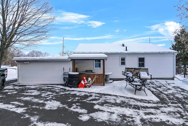 view of snow covered house