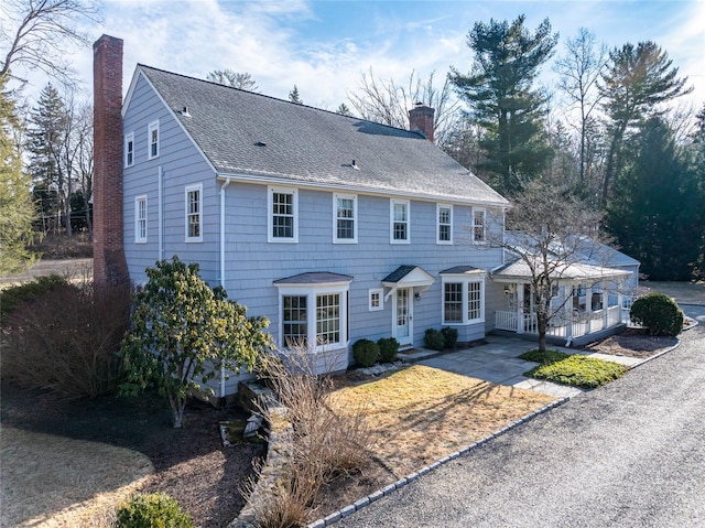 colonial-style house featuring a patio area