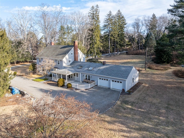 exterior space with a garage and a porch