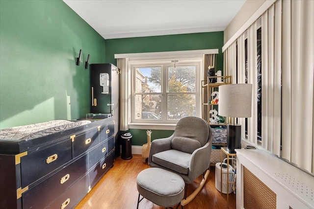 sitting room with hardwood / wood-style floors