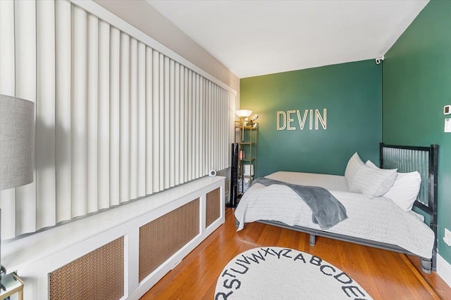 bedroom with wood-type flooring