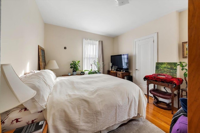 bedroom with wood-type flooring