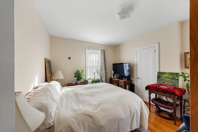 bedroom with wood-type flooring