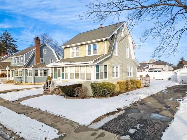 view of snow covered house