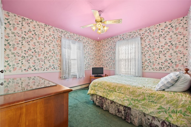 carpeted bedroom with multiple windows, a baseboard heating unit, and ceiling fan