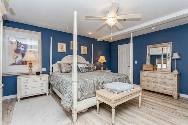 bedroom with ceiling fan and light hardwood / wood-style flooring