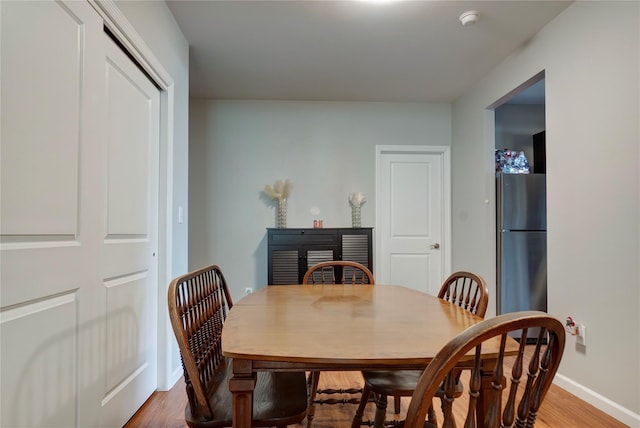 dining space featuring hardwood / wood-style floors