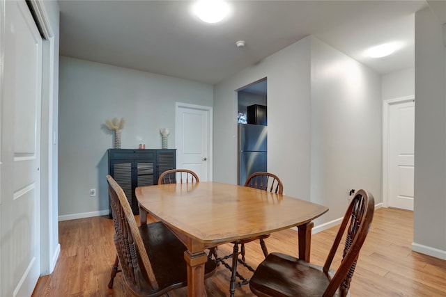 dining space featuring light hardwood / wood-style floors