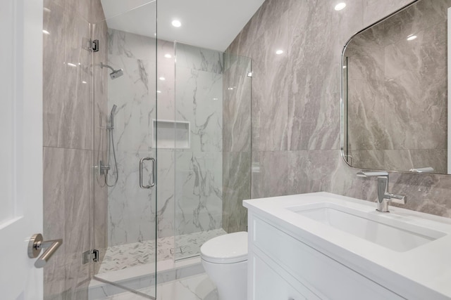 85 Dorchester Dr, Manhasset, NY 11030 - bathroom featuring a marble finish shower, toilet, tile walls, vanity, and marble finish floors