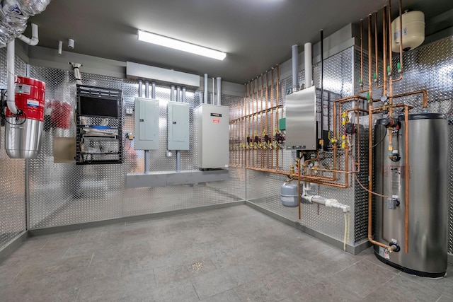 85 Dorchester Dr, Manhasset, NY 11030 - utility room with gas water heater, electric panel, and a central vacuum unit