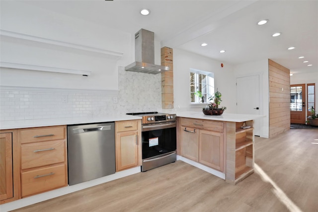 kitchen with wall chimney exhaust hood, tasteful backsplash, kitchen peninsula, stainless steel appliances, and light hardwood / wood-style floors