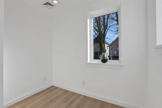 empty room with wood-type flooring