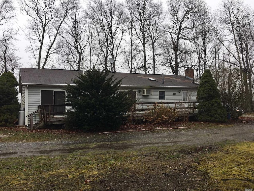 view of front of home with a wooden deck