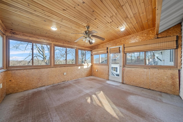 unfurnished sunroom featuring wooden ceiling and ceiling fan