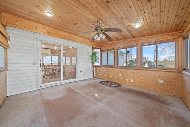 unfurnished sunroom with plenty of natural light, ceiling fan, and wood ceiling