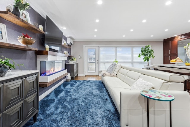living area featuring ornamental molding, a multi sided fireplace, recessed lighting, baseboards, and light wood-style flooring