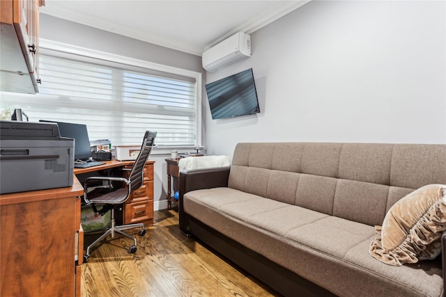 office space featuring an AC wall unit, ornamental molding, and wood finished floors