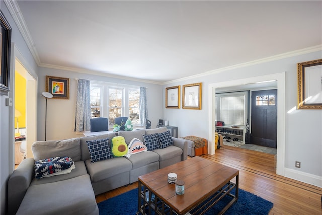 living room featuring ornamental molding, plenty of natural light, and wood-type flooring