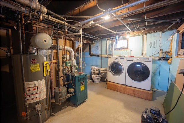 interior space with washer and clothes dryer and gas water heater