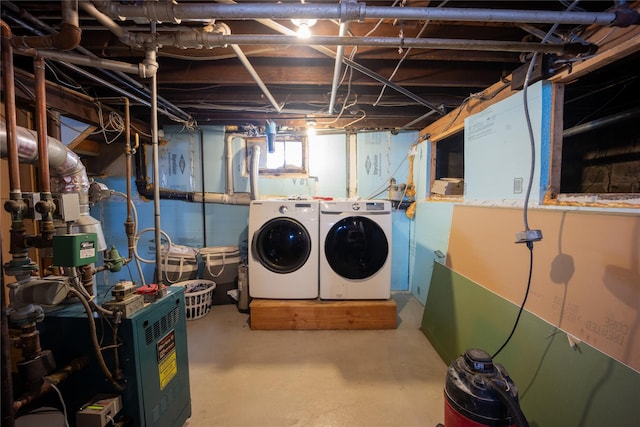 clothes washing area featuring washer and clothes dryer