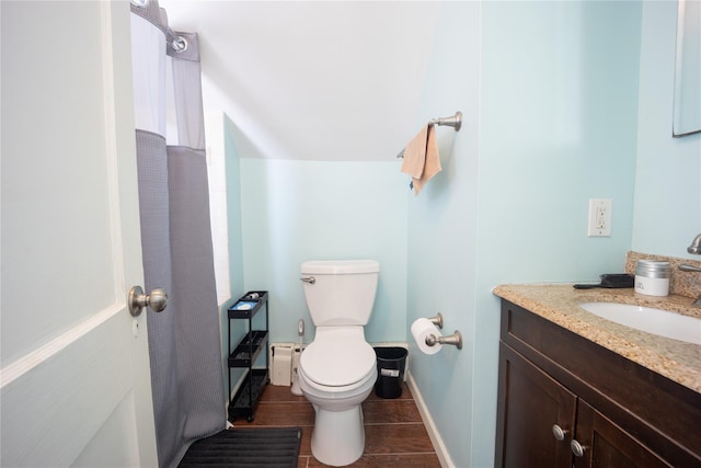 bathroom with toilet and vanity