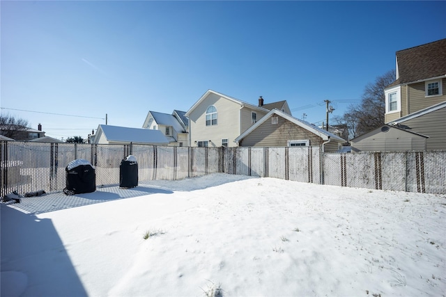 view of yard layered in snow