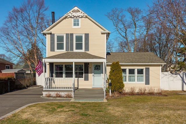 view of front of house with a front lawn and a porch