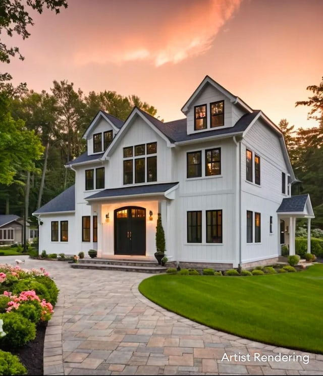 modern farmhouse featuring a yard