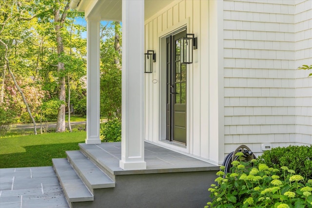 16 Hampton St, Westhampton Beach, NY 11978 - view of exterior entry with board and batten siding and covered porch