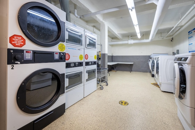 clothes washing area featuring independent washer and dryer and stacked washer and clothes dryer