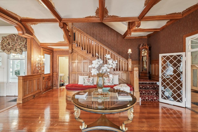 foyer entrance with beamed ceiling and hardwood / wood-style floors